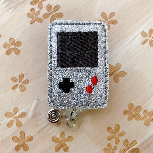 Handheld Gaming Device Removable Badge Topper